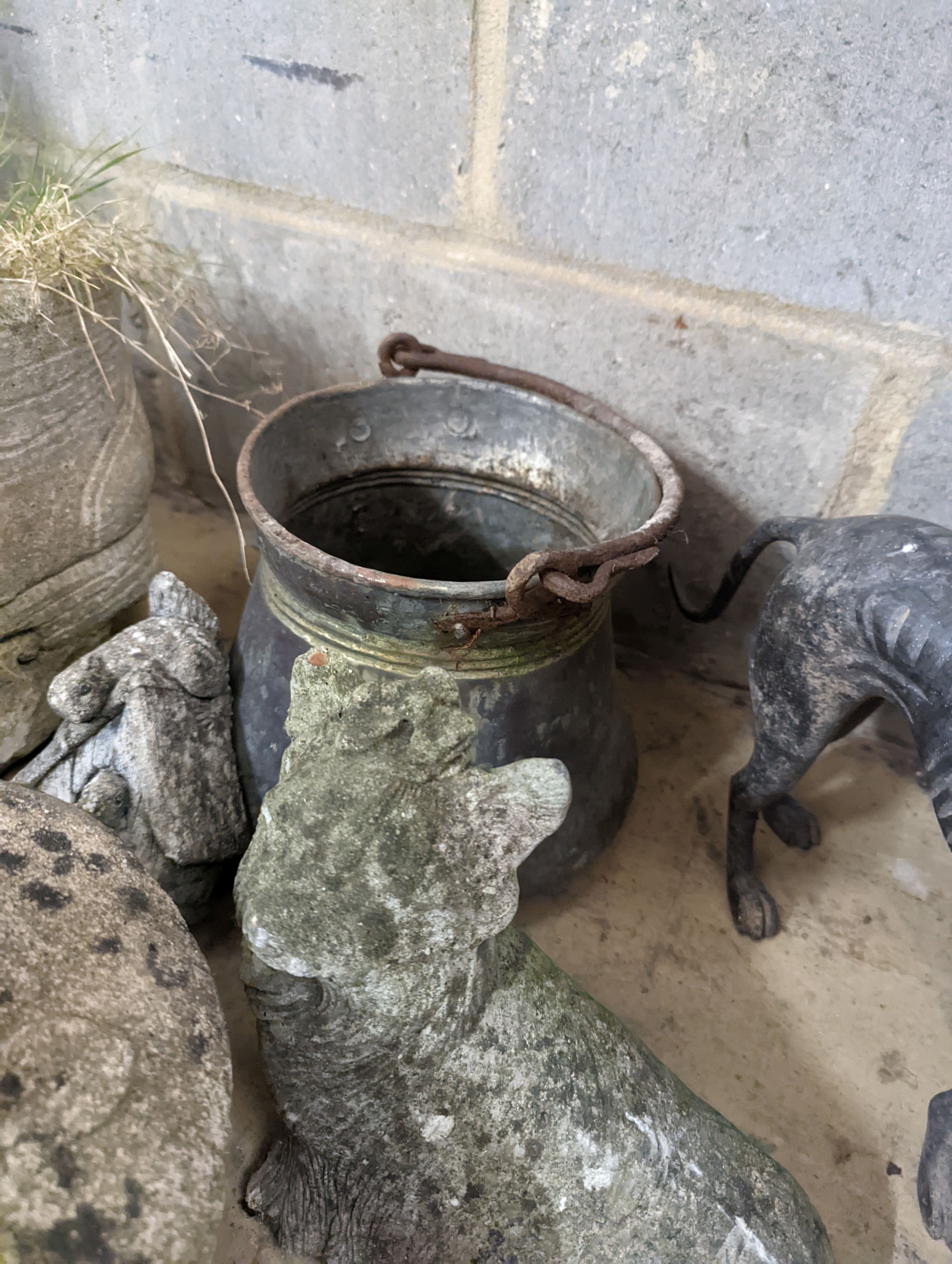 A spelter greyhound, metal pail and four garden ornaments, largest width 34cm